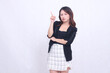 © Ajab - young asian woman 20s formal office elegant crying arms crossed pointing right up isolated white background