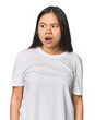 © Asier - Young chinese woman isolated being shocked because of something she has seen.