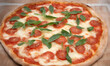 © Vicky - Pizza with mozzarella cheese, tomatoes and basil on a wooden board