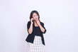 © Ajab - Asian office woman in her 20s, an expression of disgust while making a telephone call using a cellphone gadget for promos while her hand covers her mouth