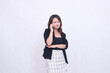 © Ajab - the charm of a beautiful Asian office woman in her 20s with a sullen expression while making a phone call on a cellphone gadget with her arms crossed isolated on a white background
