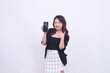 © Ajab - charm of beautiful asian office woman 20s cheerful expression carrying cellphone gadget facing back while hand thumbs up okay sign isolated white background