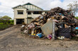 © Austockphoto - clean up after flooding, funny sign shows Australian humour even during a natural disaster