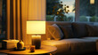 A designer table lamp illuminating a corner of a modern living room, casting a warm glow. 