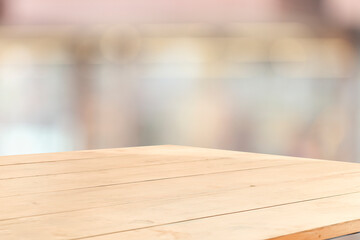 Poster - wooden table on blurred window background for displaying product mockup