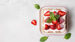 © Miva - A delicious strawberry dessert topped with whipped cream and fresh mint