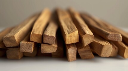 Poster - A pile of wood sticks sitting on top of a table. Suitable for construction, DIY projects, or rustic-themed designs