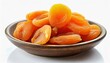 Bowl of dried apricots isolated on white background. Organic snack.