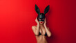 © ksu_ok - Woman banny mask with standing on red background