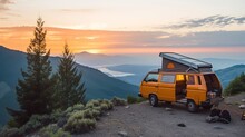 Solitary Retro Yellow Camper Van Parked On A Serene Mountain Peak At Twilight.
