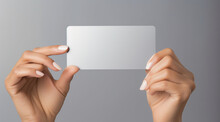 Hand Presenting A Blank White Card, Ideal For Advertising And Mockups.