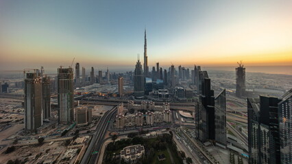 Wall Mural - Aerial view of tallest towers in Dubai Downtown skyline and highway timelapse.