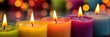 Colorful candles with burning wicks and bright wax