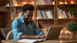 © Studio Nova - professional middle-aged man sitting at a desk with a laptop