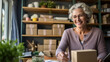 © tong2530 - A mature woman running online store, Her is owner of small online shop. Receiving orders and packing boxes for delivery.
