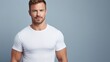 © Wolfilser - attractive strong man in white mock-up T-Shirt, looking into camera