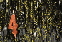 Red Decorated Burning Birthday Candle On Black Glitter Background, Number 4