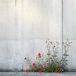 Flowers grow through a concrete wall. Nature protection concept.