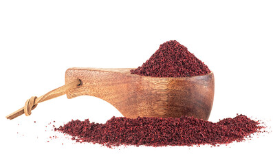 Canvas Print - Ground sumac spice pile in wooden spoon isolated on a white background