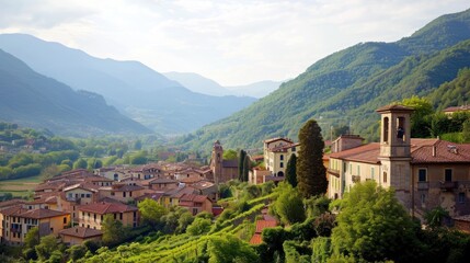 Canvas Print -  a view of a village in the middle of a valley with mountains in the back ground and trees on the other side of the valley, and houses in the foreground.