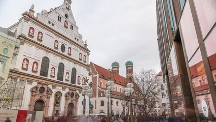 Wall Mural - View of the St. Michael's Church and the pedestrian street of Neuhauser in center of Munich timelapse. Walking street with many shops and relaxing area. Bavaria, Germany.