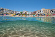 © dam - Spain, beach in the Mediterranean village of Calella de Palafrugell seen from sea surface with sand underwater, split view half over and under water, natural scene, Costa Brava, Catalonia