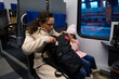 © Taras Grebinets - Authentic lifestyle portrait of diverse people travelling by high speed train.