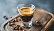 steaming espresso shot in a crystal-clear glass, capturing the rich aroma and inviting warmth of freshly brewed coffee