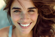 © Hunman - Portrait of beautiful naturally brunette woman, smiling and looking in camera with white teeth.