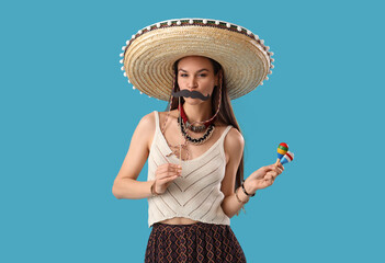 Sticker - Beautiful woman in sombrero hat, with paper mustache and maracas on light blue background