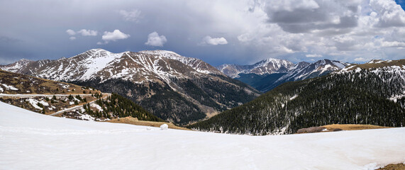 Wall Mural - Independence Pass - A panoramic view at the summit of Independence Pass (12,095 ft), looking towards east, on a stormy Spring day. Colorado, USA.