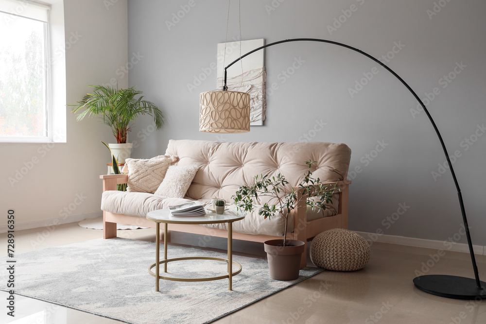 Interior of modern living room with cozy white sofa, coffee table and ...