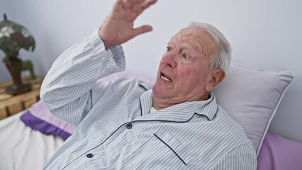 Sticker - Senior man, shocked in pyjama, sitting on bed with afraid face expression, surprised, excited, fear captured in bedroom room