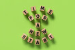 Leinwandbild Motiv Cubes with text TIME FOR A NEW START on green background