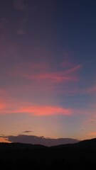 Wall Mural - breathtaking scene of the sun setting over the majestic mountains time lapse video, painting the sky