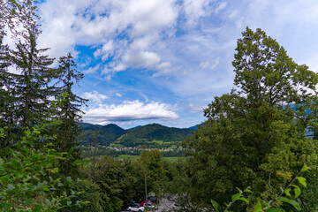 Aerial view of Slovenian village in the background seen from Bled Castle on a blue cloudy summer day. Photo taken September 14th, 2023, Bled, Slovenia.