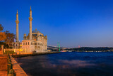 Fototapeta Na drzwi - Picturesque cityscape with the Bosphorus Strait and the Grand Mecidiye Mosque Ortakoy Mosque and the Bosphorus Bridge Istanbul, Turkey at sunset