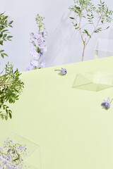 Aufkleber - Minimalistic botanical setup with delicate purple flowers and acrylic blocks on a lime table