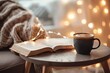 Christmas scene with cup of coffee and open book on table complemented by snug blanket on chair near window with festive lights intimate home setting captures essence of relaxing winter evening