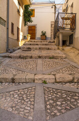 Wall Mural - A road with traditional kogule or kogulavanje paving in the Stari Grad historic centre of the coastal town of Novi Vinodolski, Primorje-Gorski Kotar County, Croatia