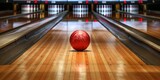 Bowling ball rolling down lane toward bowling pins in bowling alley