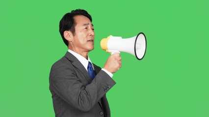 Aufkleber - ノートパソコンを見ながら考えるビジネスマン　クロマキー合成用グリーンバック
