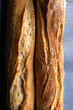 Close up shot of two baguettes of french bread highlighting the crust and texture.