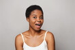 © millaf (Nemchinova) - Surprised african american female model with healthy fresh clear dark skin posing on white background. Skin care, cosmetology and beauty treatment