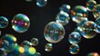 Closeup of a shiny soap bubbles with reflection on black background