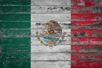 Wall Mural - The national flag of  Mexico  is painted on uneven wooden  boards. Country symbol.