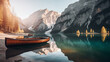 Beautiful view of traditional wooden rowing boat on scenic Lago di Braies in the Dolomites in scenic morning light at sunrise