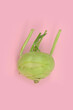 Kohlrabi on a pink background, abstraction, concept, top view, isolated. 