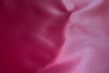 Wall Mural - Texture of smooth cold pink satin polyester fabric