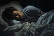 © Yuliia - Young Caucasian man peaceful sleeping laying dark night bedroom napping relaxed calm guy sleep dreaming relaxing resting at nighttime in comfortable bed orthopedic mattress dreams dark room top view